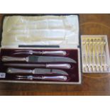 Six silver handled butter knives and a boxed stainless steel carving set