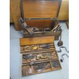 A 19th century pine carpenters tool chest with moulding and other planes, chisels, saws as per
