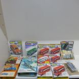 A collection of 12 unmade Dinky Toy kits and a part fit - some wear to covers and plastic