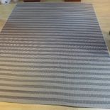A Lloyd Loom conservatory rug - 239cm x 295cm