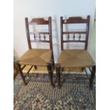 A pair of 18th/19th century side chairs with rush seats with a good colour and condition
