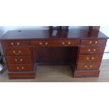 A modern mahogany nine drawer desk - Width 182cm x Height 86cm x 50cm