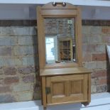 A pine hanging mirror back wall cabinet with a paneled door - Height 74cm