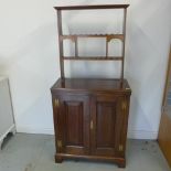 An oak two door panelled cupboard with an open rack top, nice polished colour - Height 166cm x