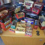 A collection of 29 boxed diecast cars mainly racing cars including a Mini Champs 1:18 Maclaren all