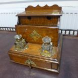 An oak desk stand with a letter rack above two inkwells and a drawer - Width 25cm