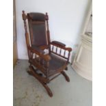 A walnut American rocking chair