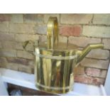 A large brass watering can - Height 50cm x Width 53cm