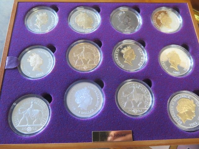 A Royal Mint Queen Elizabeth II Golden Jubilee collection - 24 silver coins in a wood effect - Image 2 of 4