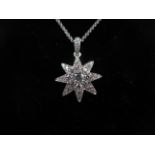 An 18ct White Gold Diamond Encrusted Star Pendant and Chain, approx. 0.75crts Of Diamonds, Pendant