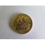 An Elizabeth II gold full sovereign dated 1958
