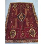 A hand knotted woolen Qashqai rug - 2.50m x 1.68m - in good condition