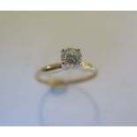 A 14ct yellow gold solitaire ring - the round brilliant cut diamond 0.52ct, VVS2, colour I - ring