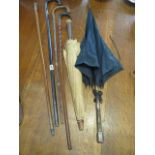 Four walking sticks/canes and two vintage parasols - some wear to parasols and sticks but reasonably