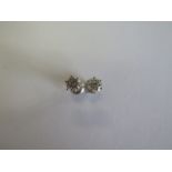 A pair of 14ct white gold diamond earrings with screw backs, each approx 0.35ct - approx total