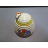 A Clarice Cliff Newport Crocus beehive honeypot - height 10cm - some wear to rim otherwise generally