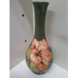 A Moorcroft bottle vase - Height 17cm - some crazing to base, otherwise good