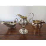 A silver sauceboat, silver cream jug and a silver milk jug - total approx weight 8.9 troy oz -
