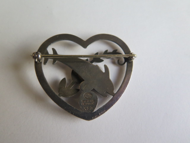 A Georg Jensen sterling silver heart brooch with two dolphins no 312 - Width 43mm - in good - Image 2 of 2