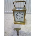 A brass carriage clock the dial signed Ross & Son - working with key