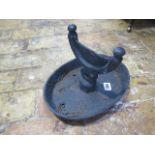 A 19th century cast iron foot scraper