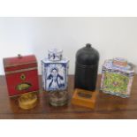 An enamel tea caddy - Height 10cm - two other caddies, an ebonised lidded pot and three small boxes,