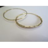 A 14ct yellow gold diamond hinged bangle - 5.5cm x 6.5cm external, approx weight 9.4 grams and a 9ct