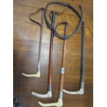 Four vintage riding crops two with silver rims - all with some wear except one