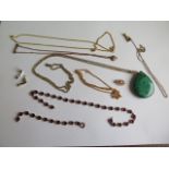 A collection of gilt metal chains, a broken necklace and a Malachite pendant