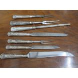 Seven silver handle carving knives, forks and a steel