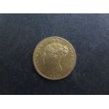 A Victorian gold half sovereign dated 1865
