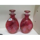 A pair of ruby/cranberry etched glass triform dimple decanters - Height 23cm - both good