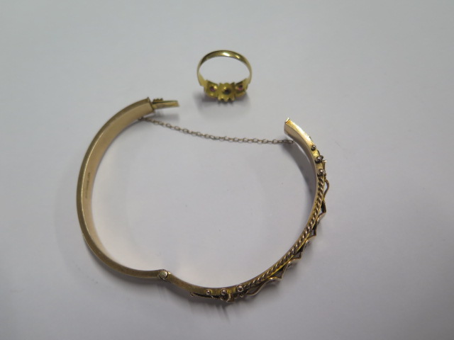 A 9ct hallmarked yellow gold bangle - 6.5cm x 5.5cm external - approx weight 12 grams and a - Image 3 of 3