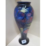 A Moorcroft blue ground Anemone vase - Height 27cm - in good condition