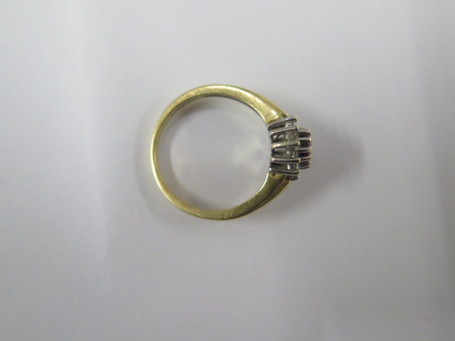 A hallmarked 18ct yellow gold diamond ring with a central red stone - ring size M - approx weight - Image 3 of 3