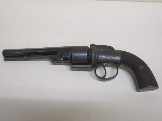 A 19th century percussion pistol - the sighted barrel engraved Powell with a six shot revolving