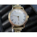 A 9ct yellow gold Bueche Girod ladies quartz watch - 23mm case - on a plated bracelet strap - not