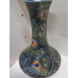 A Moorcroft Peacock feather vase - Height 29cm - slight crazing to base otherwise good condition