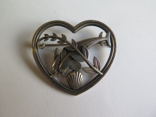 A Georg Jensen sterling silver heart brooch with two dolphins no 312 - Width 43mm - in good