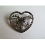 A Georg Jensen sterling silver heart brooch with two dolphins no 312 - Width 43mm - in good