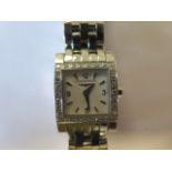 A ladies Longines wristwatch - rectangular white brushed dial, silver coloured Arabic numerals at