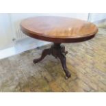 A Victorian mahogany circular tilt top breakfast table on a tripod base - Height 71cm x Diameter