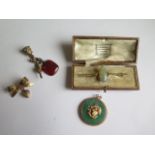A gilt metal pin brooch, gilt metal Chinese pendant, gilt metal fobs and watch key and a gilt