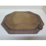 A Thompson Mouseman of Kilburn octagonal breadboard - 31cm x 25cm - no splits or cracks, some