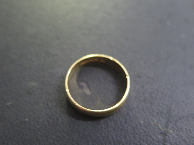 A 22ct band ring size S/T - approx weight 5.4 grams - some usage marks