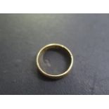 A 22ct band ring size S/T - approx weight 5.4 grams - some usage marks