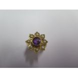 An 18ct yellow gold amethyst and pearl flower ring size M - approx weight 8.6 grams - in good