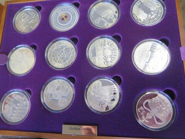 A Royal Mint Queen Elizabeth II Golden Jubilee collection - 24 silver coins in a wood effect - Image 3 of 4