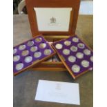 A Royal Mint Queen Elizabeth II Golden Jubilee collection - 24 silver coins in a wood effect
