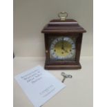 A Comitti of London mahogany mantle clock with Hermle chiming movement in good working order -